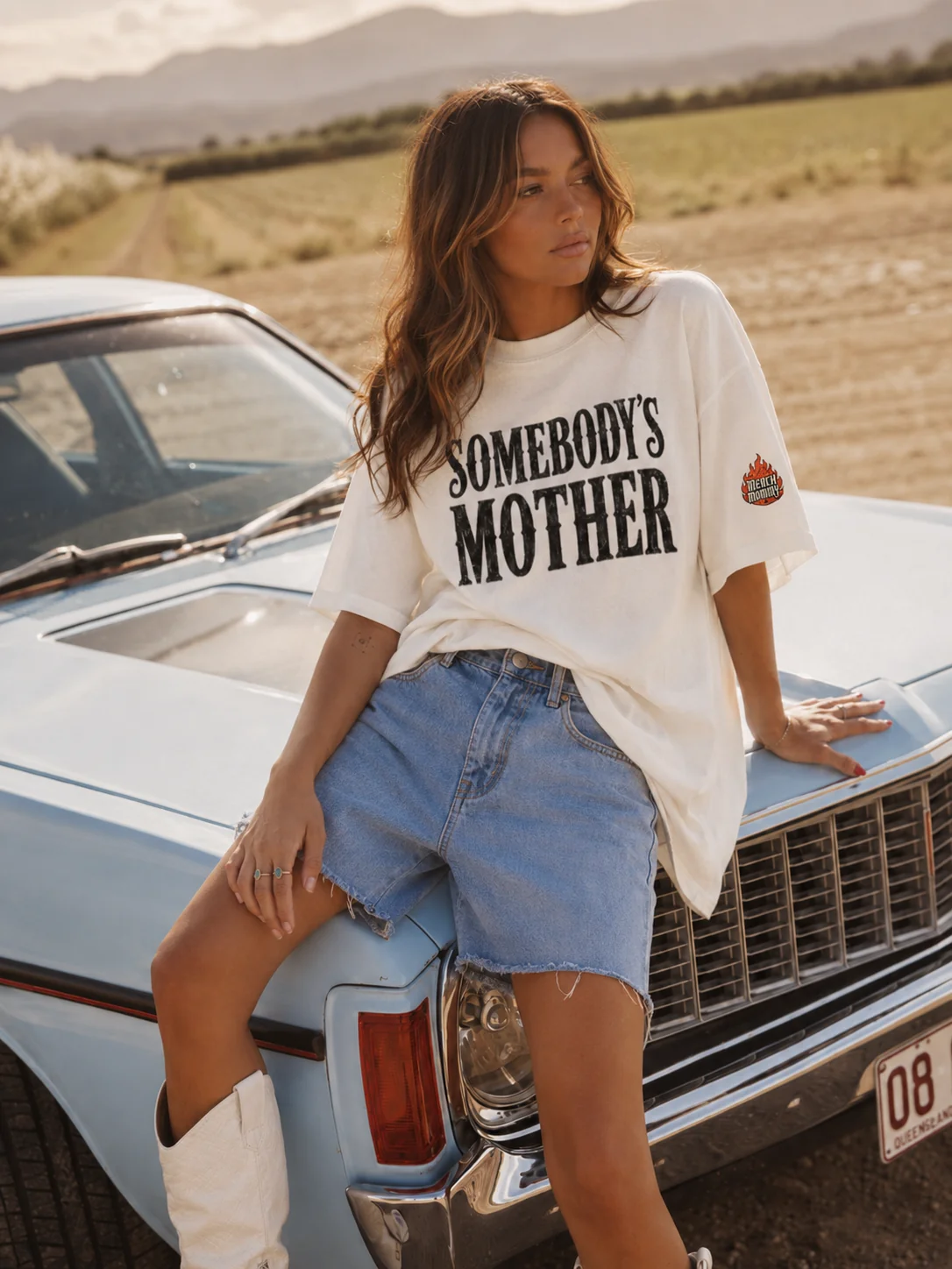 Woman wearing a Somebody's Mother T-shirt